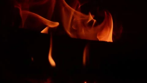 Flame, orange against a dark background Stock Footage 324614114