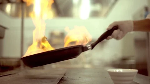 Flame in a Pan. Professional Chef Preparing Food with Fire on Pan. Stock Footage 82168267