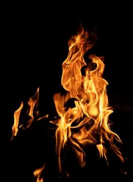 Flame pattern. Flames on black backdrop. Glowing flames on black background Stock Photos