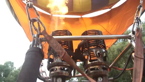 Flame rising and inflating hot air balloon Stock Footage 154368562