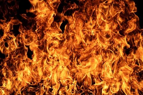 Flame shows glowing flames. Flame with black background. Burning flame for Stock Photos