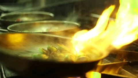 Flame Sizzling Veggies In Frying Pan Stock Footage 82734538