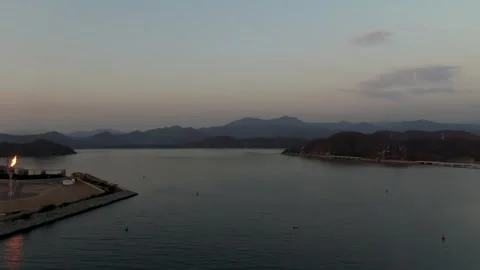 Flame stack and industrial platform on the Escollera El Edén with calm waters Stock Footage 318171679