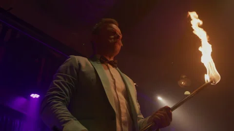 Flame on a Stage held by Man Stock Footage 270485454