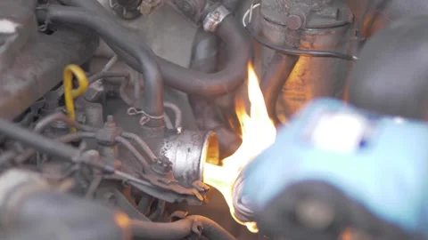 Flame starting cold diesel engine through manifold Stock Footage 297673289