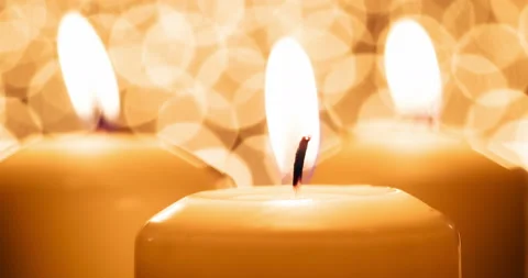 Flame of Three Candles Slowly Sways 4K Stock Footage 104087956