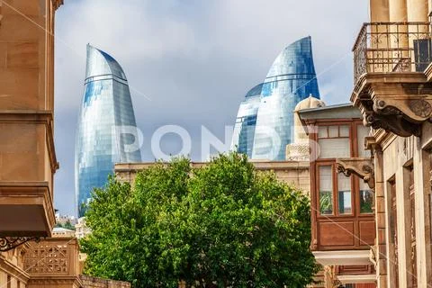 Flame towers in the cityscape Stock Photos