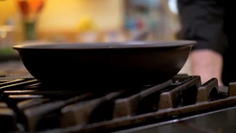 Flame turning on stove under pan Stock Footage 117541505