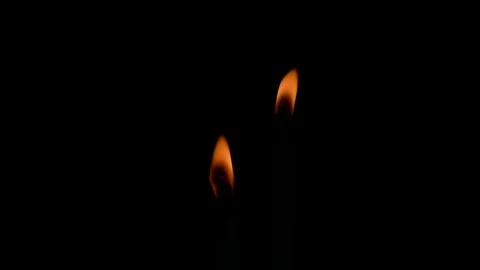 The flame of two candles burning in the dark Stock Footage 119944797