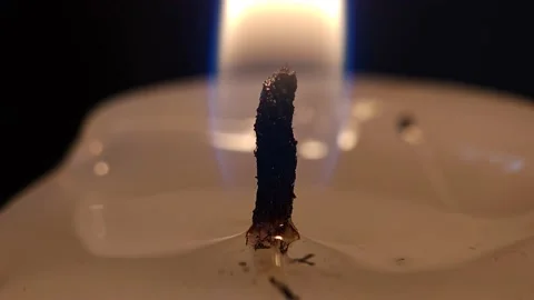 Flame of a wax candle in macro 4k Video stock 239158310