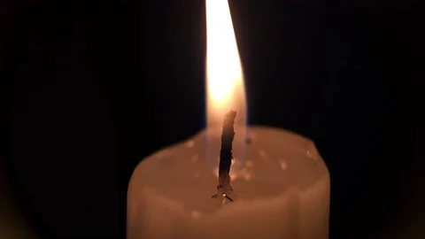 Flame of a wax candle in macro 8k Stock Footage 239158307