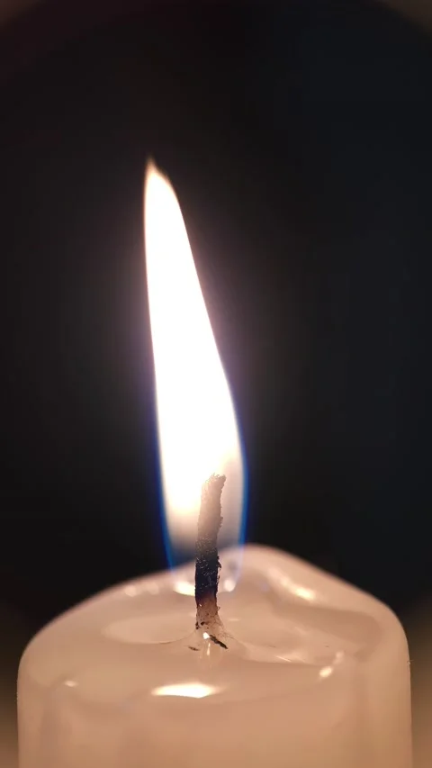 Flame of a wax candle in macro 8k Stock Footage 239158313