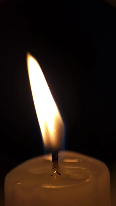 Flame of a wax candle in macro 8k Stock Footage 239158359