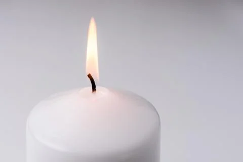 Flame from a white candle Fotos de archivo