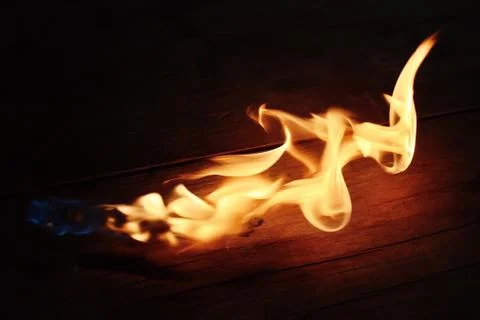 Flame on a wood Stock Photos
