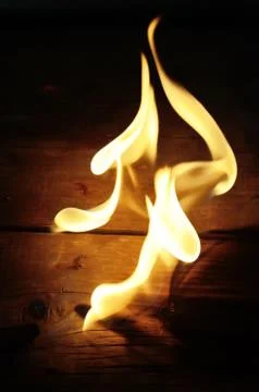 Flame on a wood Stock Photos