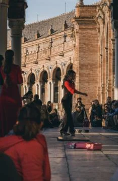 Flamenco dancer performs in front of the crowd in Plaza de Espana, Seville, S Stock Photos
