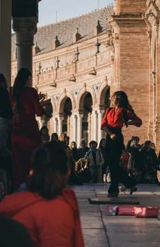 Flamenco dancer performs in front of the crowd in Plaza de Espana, Seville, S Stock Photos