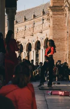 Flamenco dancer performs in front of the crowd in Plaza de Espana, Seville, S Stock Photos