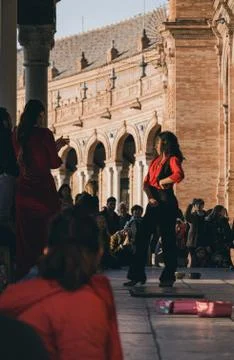 Flamenco dancer performs in front of the crowd in Plaza de Espana, Seville, S Stock Photos