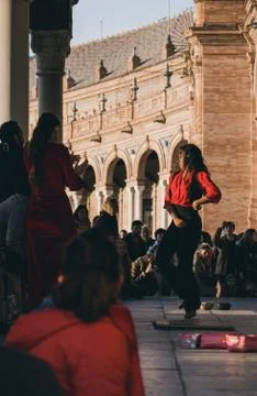 Flamenco dancer performs in front of the crowd in Plaza de Espana, Seville, S Stock Photos