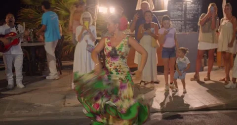 Flamenco dancer performs outdoors in Menton as musicians play and spectators Vídeo Stock 342607172