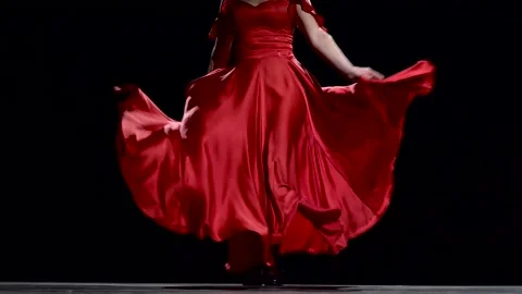Flamenco. Dancer in the rhythm of the music develops her skirt. Black background Stock Footage 92144173