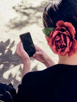 Flamenco dancer using mobile phone. Stock Photos