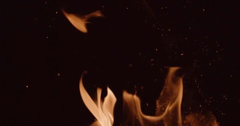 Flames and sparks flicker in foreground in slow motion Stock Footage 102789937