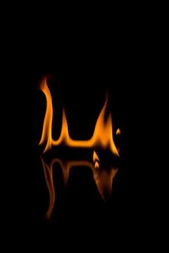 Flames with a black background. Close up. Stock Photos