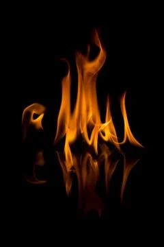 Flames with a black background. Close up. Stock Photos