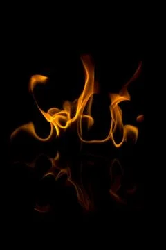 Flames with a black background. Close up. Stock Photos