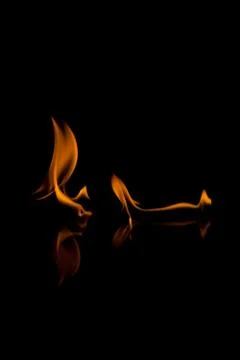 Flames with a black background. Close up. Stock Photos