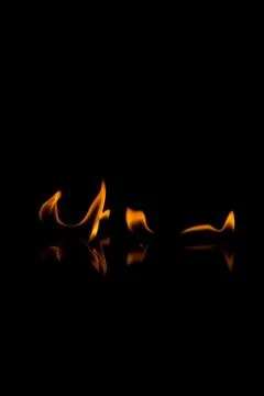 Flames with a black background. Close up. Stock Photos
