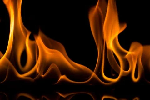 Flames with a black background. Close up. Stock Photos