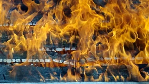 Flames break through the burning planks. Stock Footage 334440070