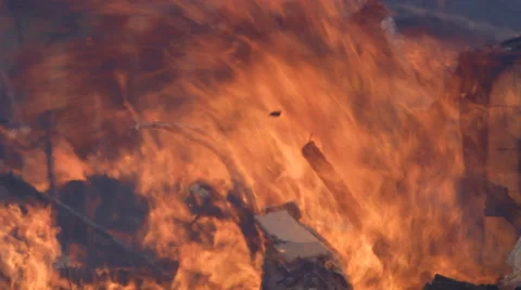 Flames burn amid the rubble of a house fire Stock Footage 59222416