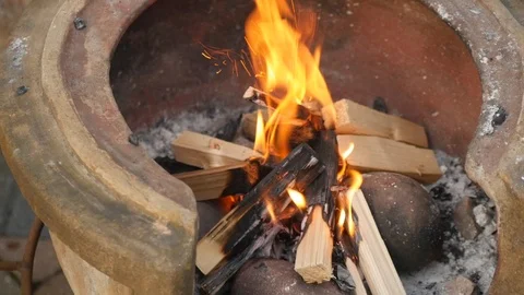 Flames burn in a firepit Stock-Footage 115055270