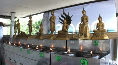 Flames Burn In Front Of Buddha Statues 스톡 동영상 12323831