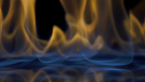 Flames burn on the mirror surface on a black background Stock Footage 100605045