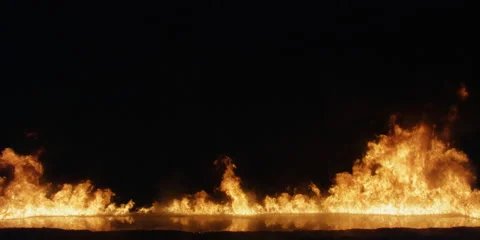 Flames burning across the screen but seldom as high as center frame Stock Footage 59124903