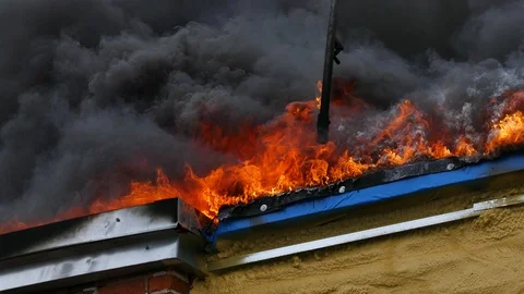 Flames burning buidling under construction Stock Footage 114945422