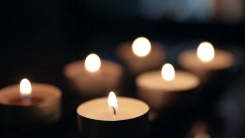 Flames of  burning candles in low light, Remembrance Day. Footage HD. Stock Footage 147692172