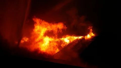 Flames completly destroying structure Stock Footage 115969151
