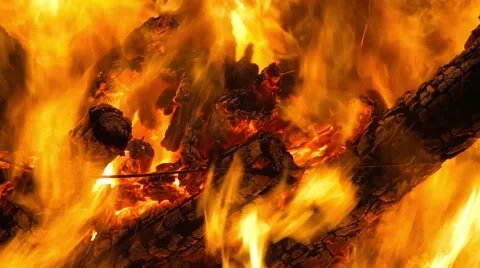 Flames consume the dry wood while highlighting the very hot heat Stock Footage 64840644