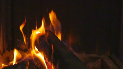 Flames consuming firewood burning in fireplace Stock Footage 148059221