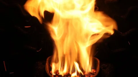 The flames dance in the crucible of a stove Stock Footage 84900301