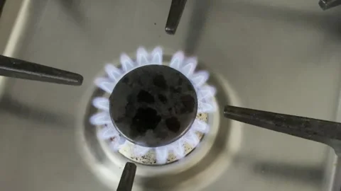 Flames dance on a kitchen gas stove burner Stock Footage 341292962