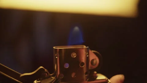 Flames dance as zippo lighter ignites in close-up footage of fire Stock Footage 319903249