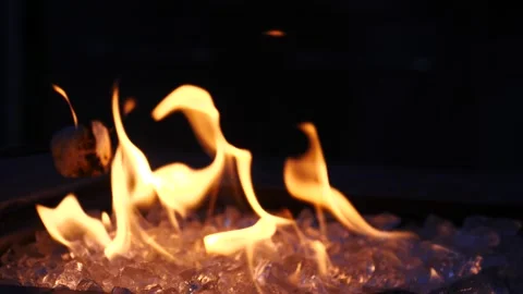Flames dancing over ice in a dramatic fire and ice demonstration Stock Footage 281815886